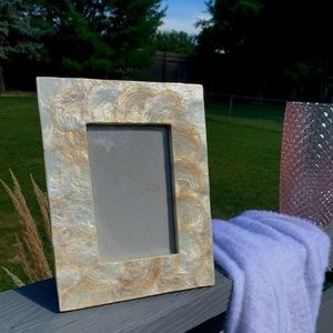 Cream and gold shell finish picture frame.